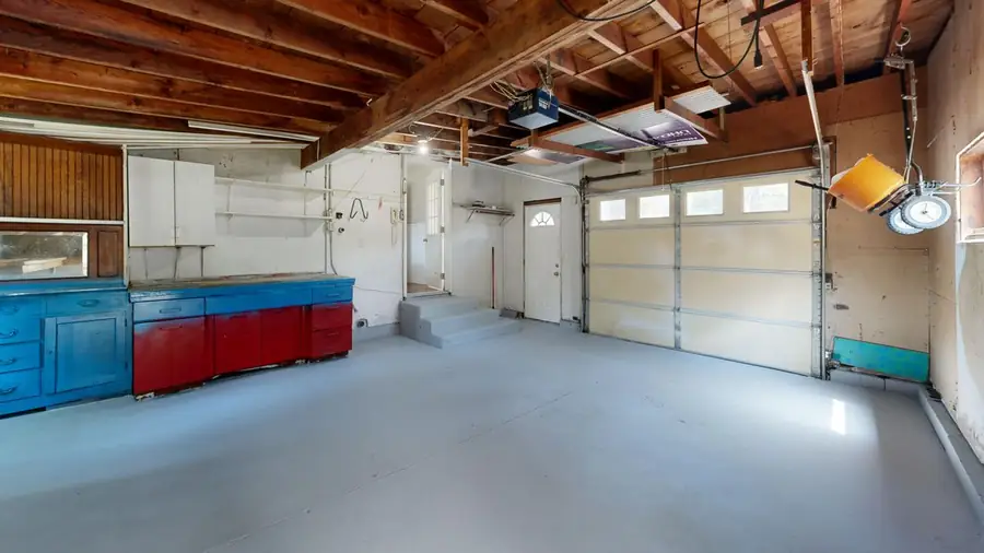 Worn concrete floor in an older Bismarck ND garage before grinding and coating